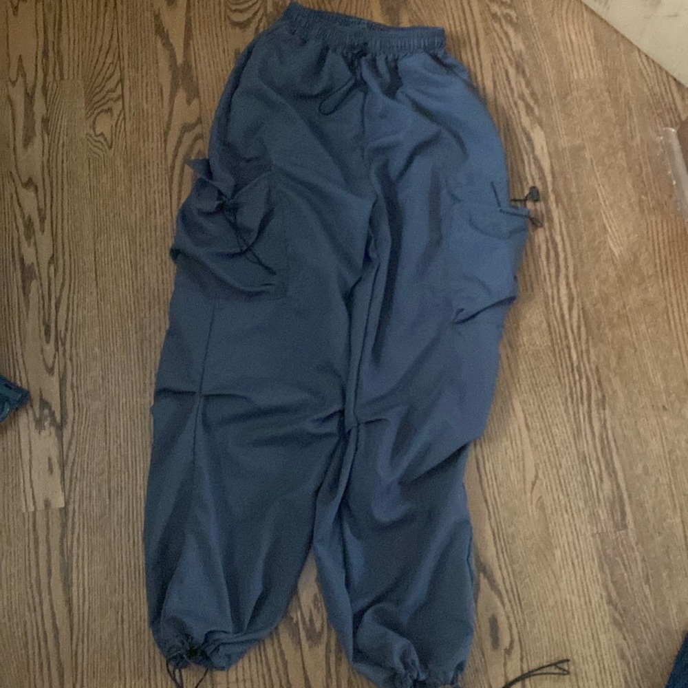 Dark gray cargo pants. Size women’s XS-M. 4 pockets. Adjustable waist and cuffs